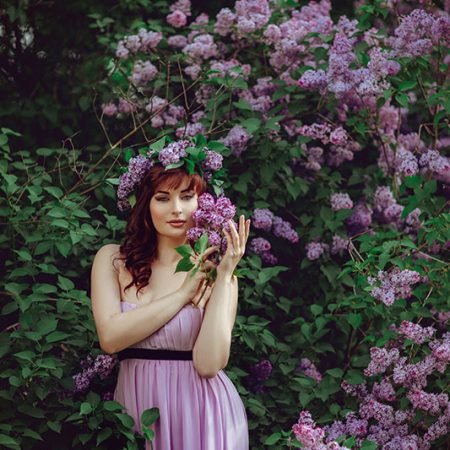 beautiful-girl-in-purple-dress-with-lilac-flowers-FPDYXV6.jpg