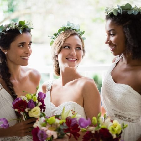 bride-and-bridesmaids-standing-with-bouquet-WUP98TF.jpg